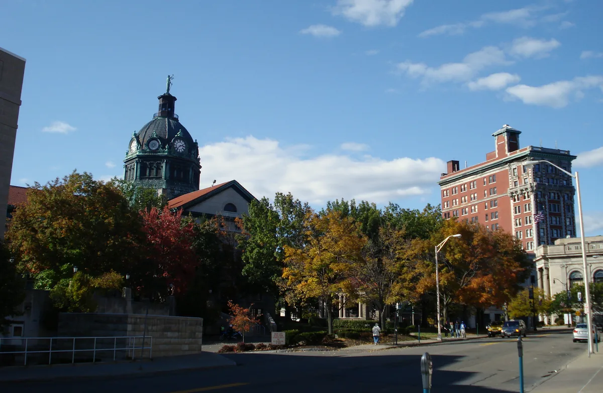 Downtown Binghamton in autumn, with the domed courthouse and fall trees.